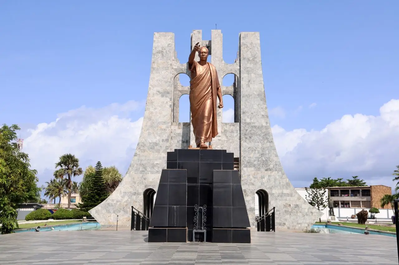 A striking view of the Kwame Nkrumah Mausoleum in Accra, showcasing the bronze statue and marble arch.